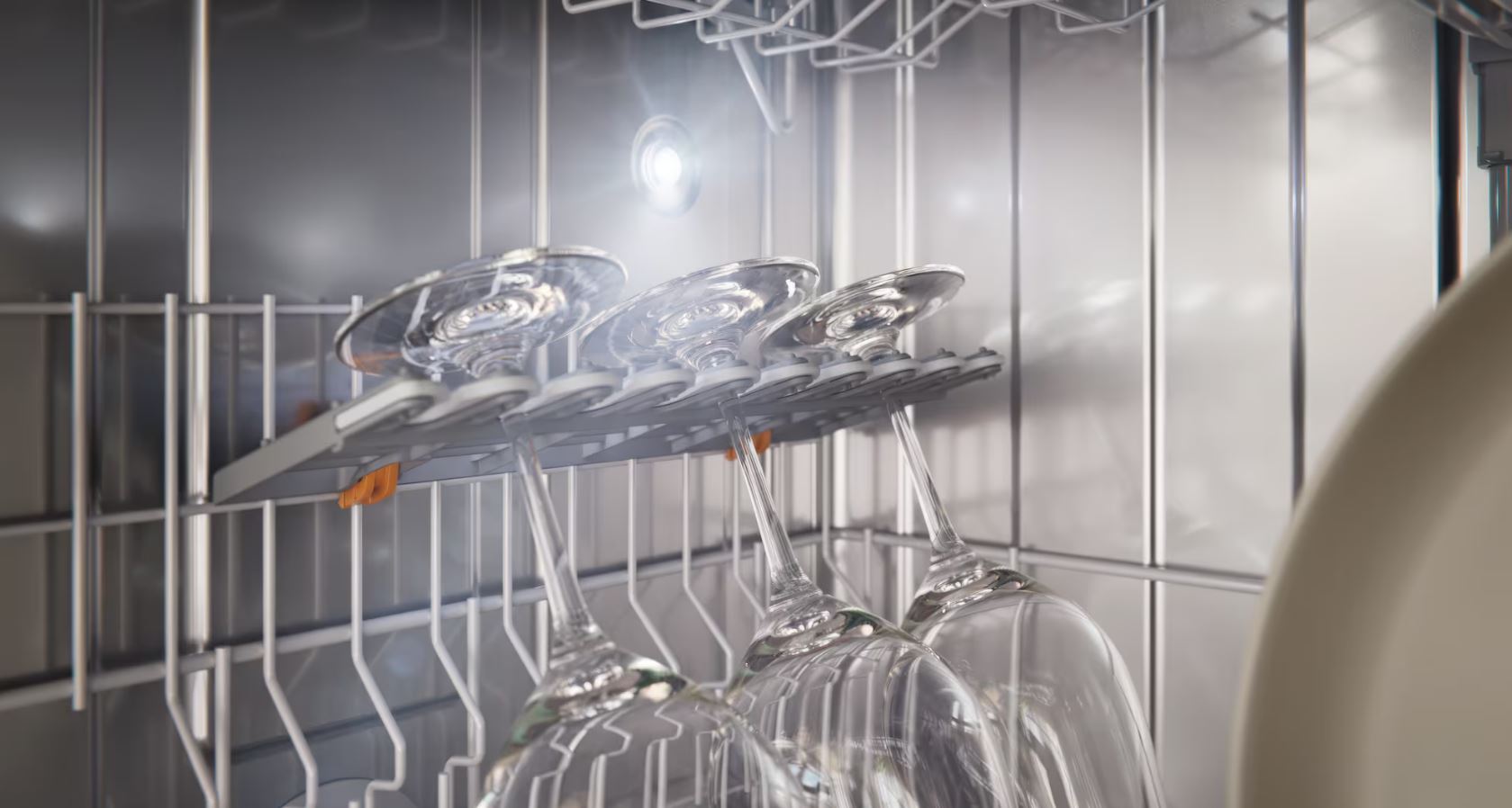 Example of a well-loaded dishwasher using  flexible racks, fold-down tines and allowing clear spray arm access.