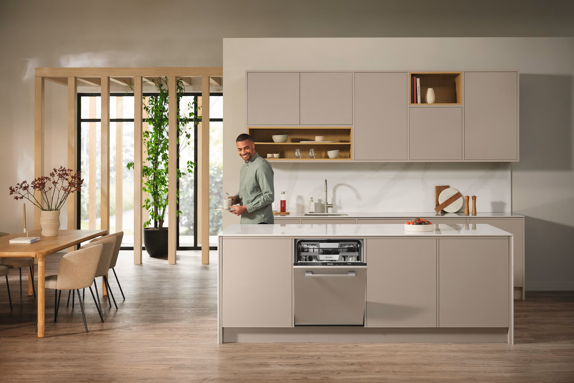 An integrated dishwasher blends seamlessly into your kitchen units, hidden behind a matching cupboard door