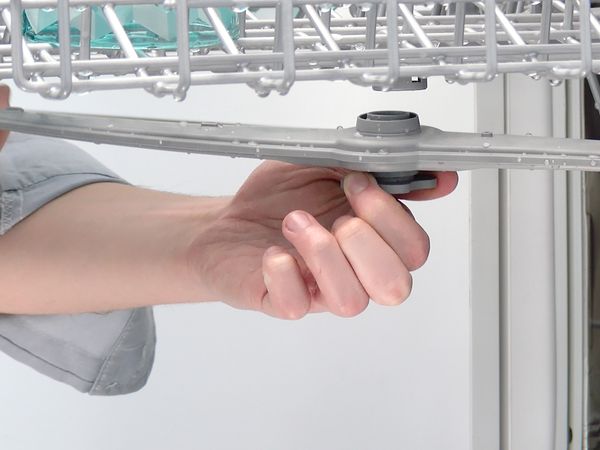 Removing the dishwasher spray arm (Image: Bosch)